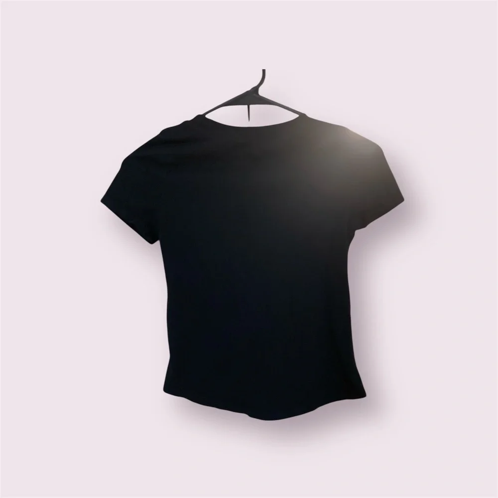 Nike black with purple swoop girls T-shirt Size Medium EUC